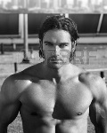 23662932-black-and-white-portrait-of-a-hot-muscular-male-model-on-rooftop